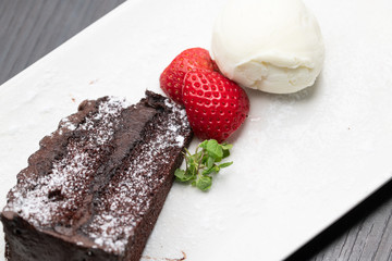 Chocolate cake with ice cream and strawberry