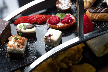 Indian style afternoon tea desserts with stand