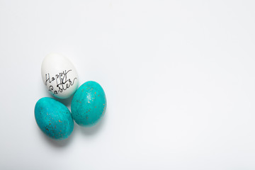 Easter eggs on a white background, place for text, top view, isolation,