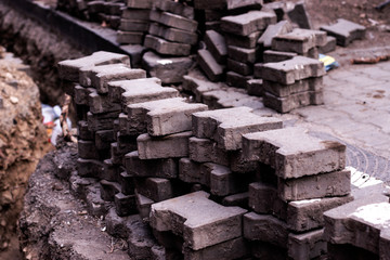 Paving stones. Scattered paving bricks.