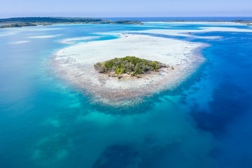 Seen from the air, a remote, tropical island lies amid the Molucca Sea in Indonesia. This beautiful region is thought to be amid the world's epicenter of marine biodiversity.