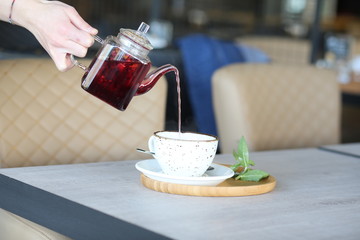 cheese cake next to herbal tea