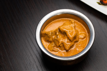 Traditional indian curry in dark background