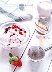 organic homemade ice cream in glass bowl on wooden background