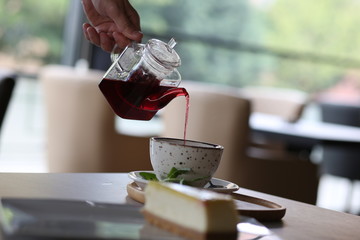 cheese cake next to herbal tea