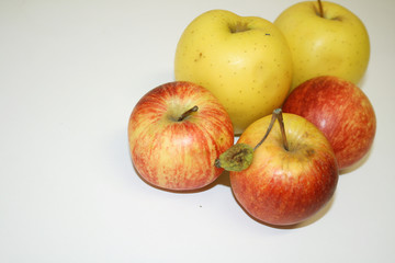 Apples red and yellow on white background