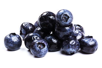 a handful of blueberries close-up isolated on white background