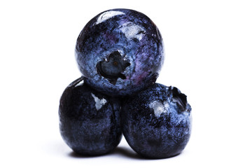 a handful of blueberries close-up isolated on white background