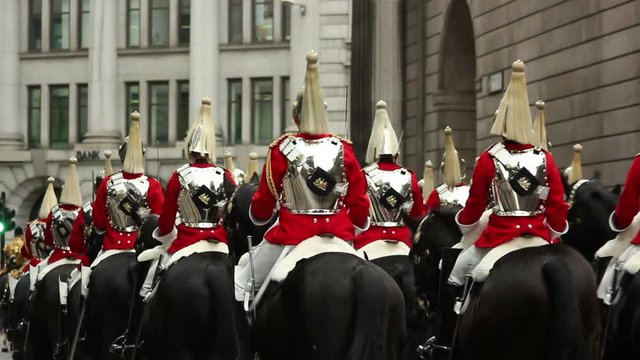 British Queen's Horse Guards in a parade. They are dressed in full armour and horseback riding through London. Stock Video Clip Footage