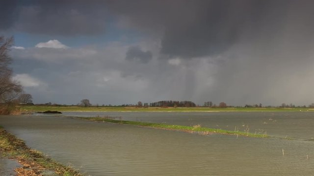 Water running over the floodplains of the river IJssel during flooding caused by high water levels in the river in Overijssel The Netherlands 