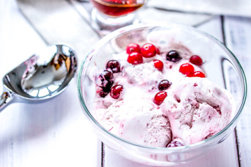organic homemade ice cream in glass bowl on wooden background
