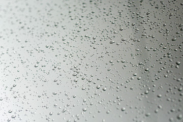 drops of rain on glass , rain drops on clear window, selective focus
