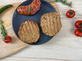 Panorama of hot grilled sausages, top view