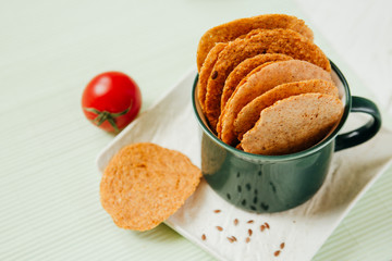natural diet vegetarian chips on a light green background