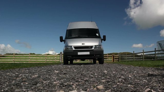 Silver Van drives over the Camera to reveal underneath. Stock Video Clip Footage
