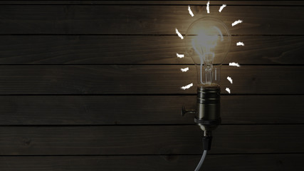 idea light bulb Flickering Tungsten light bulb lamp over black background