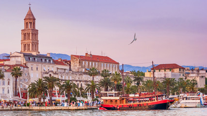 Coastal summer cityscape - view of the promenade the Old Town of Split with the Palace of Diocletian and bell tower of the Cathedral of Saint Domnius, the Adriatic coast of Croatia