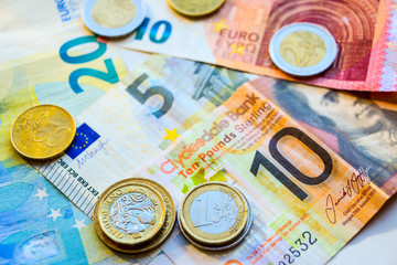 Euro and Pound banknotes and coins