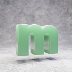 Jade letter M lowercase on rocky backgrond