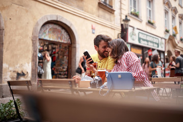 beautiful young couple having a good time on street cafe in prague. Vaneltine, Europe, Prague - obrazy, fototapety, plakaty