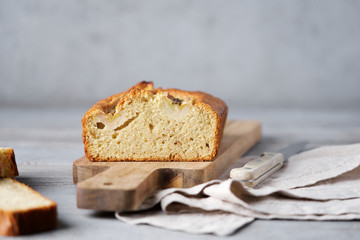 Banana sweet bread sliced on  wooden cutting board. Healthy Diet Breakfast Concept