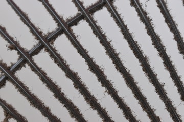 Close-up the dirty grill of electric fan, air pollution and health care concept.