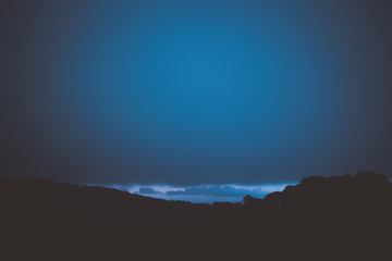 Fototapeta premium silhouette from top of mountain before sunrise on new year 2020