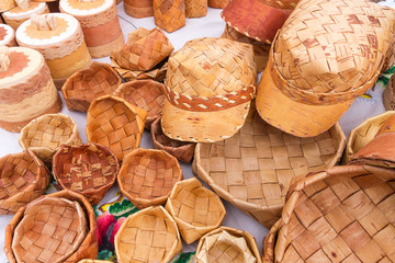 Folk craft from natural material, wickerwork made of birch bark, exhibition and sale