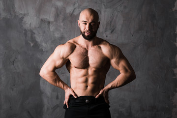 Fototapeta na wymiar handsome muscular stylish bald man