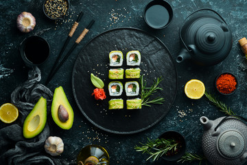 Japanese sushi -Green dragon. Avocado, onion, salmon and sushi cheese. Top view.