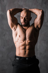 Fototapeta premium handsome muscular stylish bald man