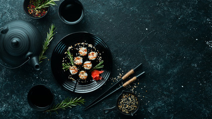 Sushi maki with eel, rice and Unagi sauce. Japanese food set. Top view