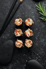 Sushi maki with eel, rice and Unagi sauce. Japanese food set. Top view
