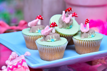 cupcakes with pink frosting and sprinkles
