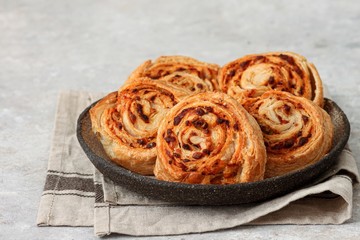 Burekas rolls with cheese, tomato sauce and olives