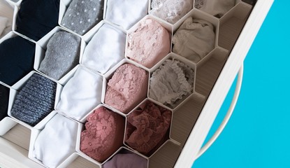 Closeup shot of a honeycomb drawer organizer in the closet