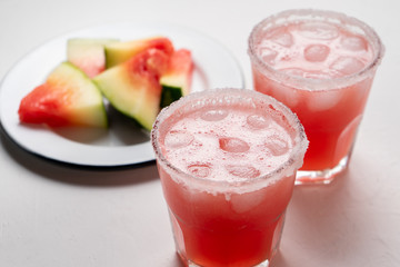 Mexican watermelon margarita cocktail on white background