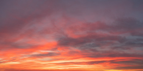 Naklejka na ściany i meble Twilight sky and clouds panorama with orange hues