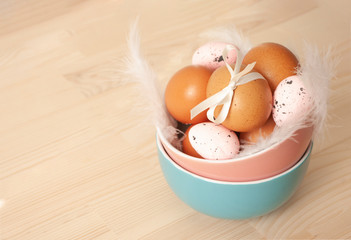 chicken eggs, quail eggs in ceramic bowl, easter food, traditional, catholic, orthodox holiday....