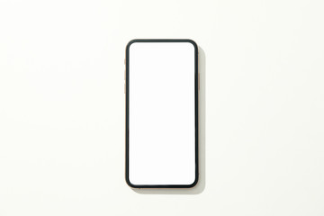 Phone with empty screen on white background, top view
