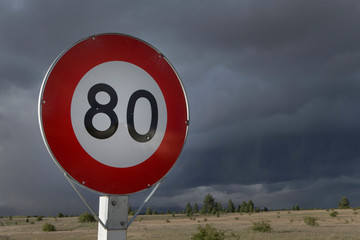 Highway 8 near Twizel.  Lake Ruataniwha. Ben Ohau. New Zealand. Speed limit sign 80