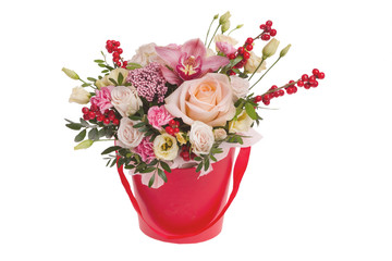 Artificial rose flowers in green vase on white background.