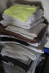 Fototapeta na wymiar Dry clean fresh laundry and clothes pile