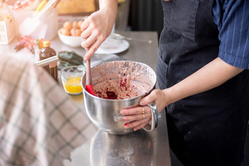 Beautiful woman is making bakery