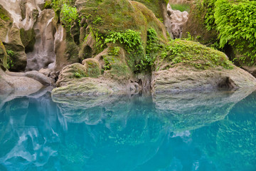 Naklejka na ściany i meble Amazing crystalline blue water of Tamul waterfall, Close up view of spectacular Tamul River,at Huasteca Potosina in San Luis Potosi, Mexico