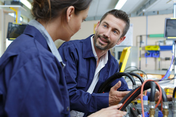 factory workers having conversation while at work