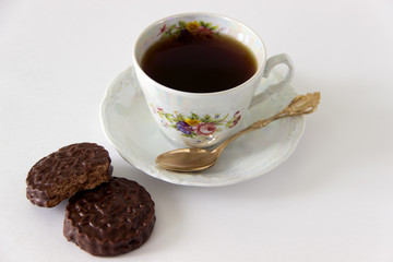 Cup of coffee with cookies and sugar