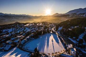 Stunning sunset over the Crans Montana village, above the Rhone valley, in Valais, Switzerland on a...