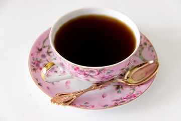 Black tea in a beautiful colored cup