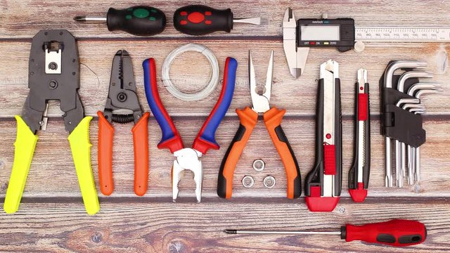 Construction and do it yourself tools disappear from wooden table - Stop motion 